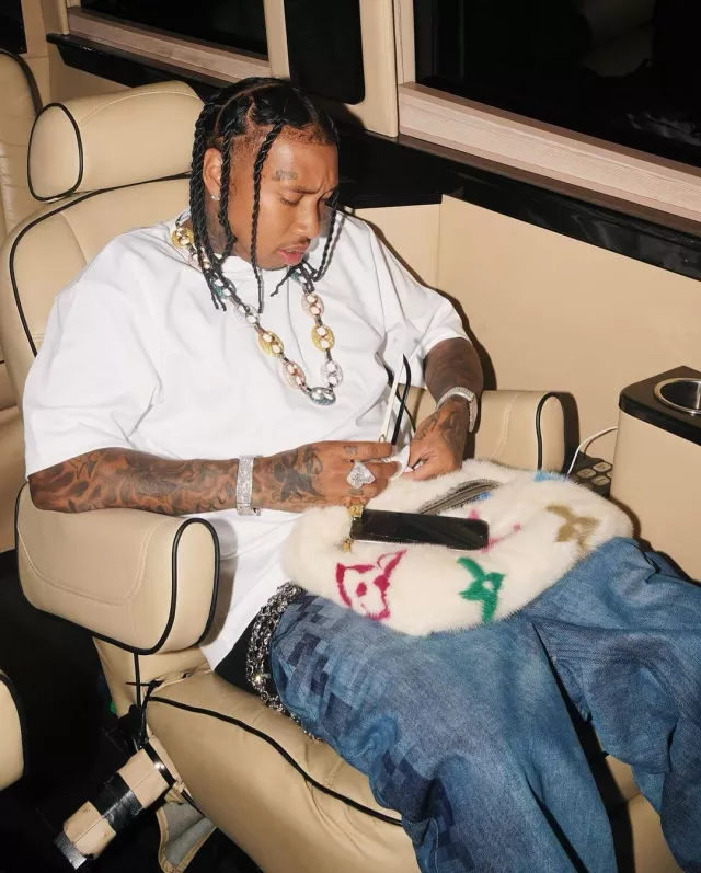 Loewe Blue Pixelated Baggy Jeans worn by Tyga on the Instagram account @tyga
