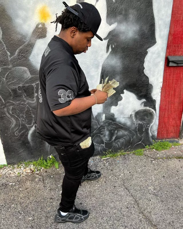 Amiri Overdyed Black Bandana MX1 Jeans worn by Big30 on the Instagram account @ceobig30