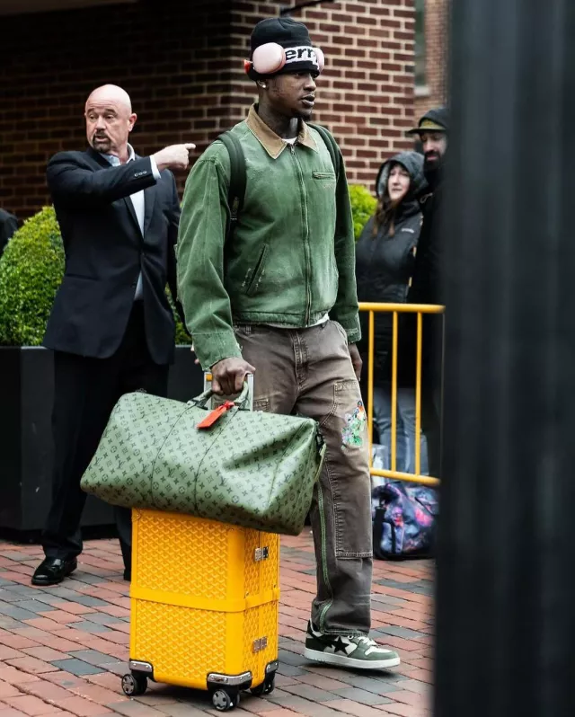 Goyard Yellow Bourget PM Trolley Suitcase worn by Terry Rozier on the Instagram account @leaguefits