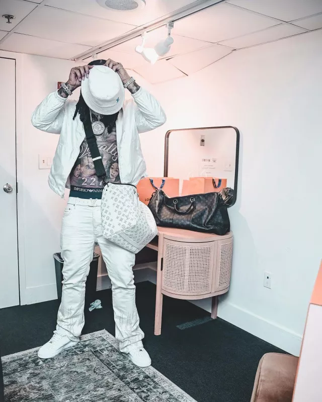 Louis Vuitton White & Navy-Monogram 'Keepall 50' Bag worn by Money Man on the Instagram account @moneyman