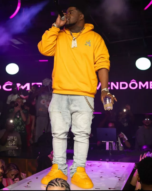 Marni Light Orange Dripping Paint Logo Hoodie worn by BossMan Dlow on the Instagram account @bossman_dlow