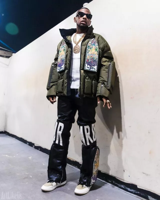 Who Decides War Olive Green Stained Glass Window Puffer Jacket worn by Fabolous on the Instagram account @myfabolouslife