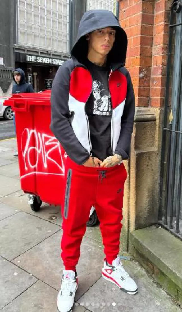 Nike Black Red White 'Windrunner' Zip Hoodie worn by Central Cee on the Instagram account @centralcee