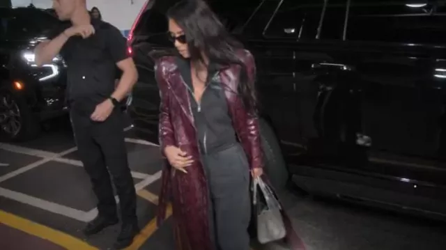 Balenciaga Snake-Ef­fect Leather Trench Coat worn by Kim Kardashian as seen in The Kardashians (S05E01)
