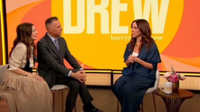 Babaton Didi Pleated Skirt worn by Drew Barrymore as seen in The Drew Barrymore Show on May 27, 2024
