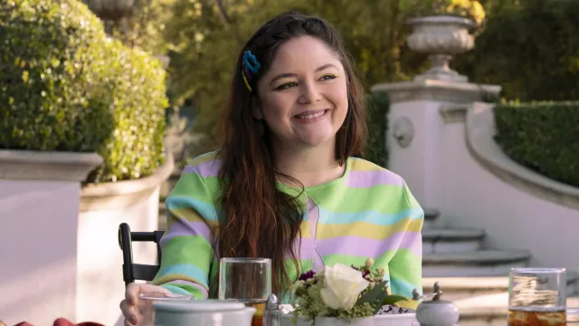 Get the look from Hacks TV series: Knit cut out cropped top worn by Kayla (Megan Stalter) in season 3, episode 7
