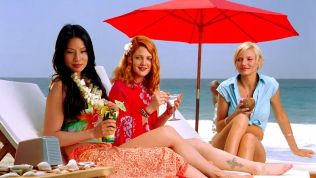 Charlie's Angels Movie Outfits: Lucy Liu is wearing Beach tropical bandeau top and Red patterned sarong to play Alex