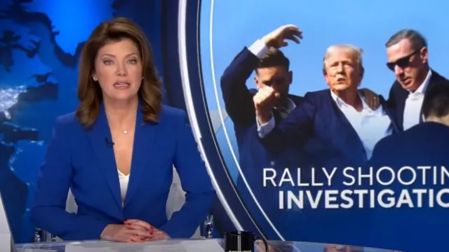 Veste Alexander McQueen en laine grain de poudre en Dr Marine portée par Norah O’Donnell vue dans CBS Evening News le 25 juillet 2024
