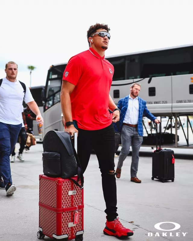 Goyard Red Bourget PM Trolley Suitcase worn by Patrick Mahomes II on the Instagram account @chiefs