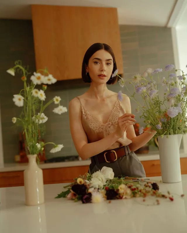 Saint Laurent Oval Wide Belt worn by Lily Collins at Vogue on August 19, 2024