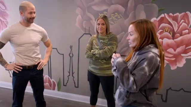 Two Chicks And A Hammer Camo Crewneck Sweatshirt worn by Brittany as seen in Good Bones (S09E01)