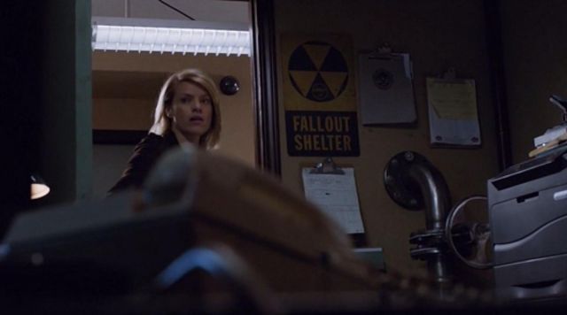 The sign "FALLOUT SHELTER" from the desk of Jennifer in Colony