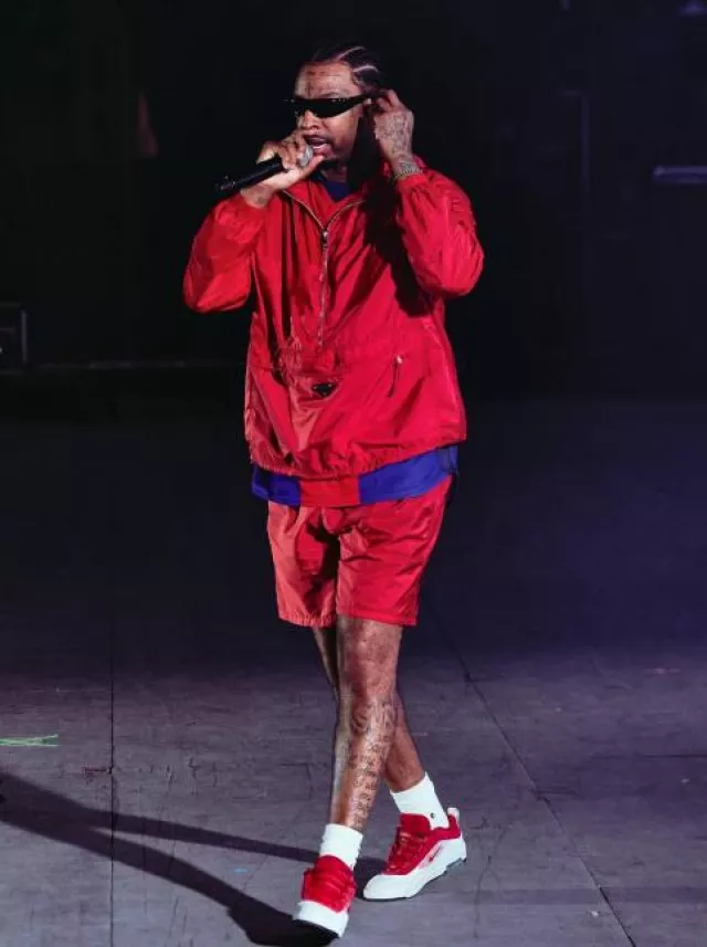 Prada Red Re Nylon Swim Shorts worn by 21 Savage on the Instagram account @thejohncanon