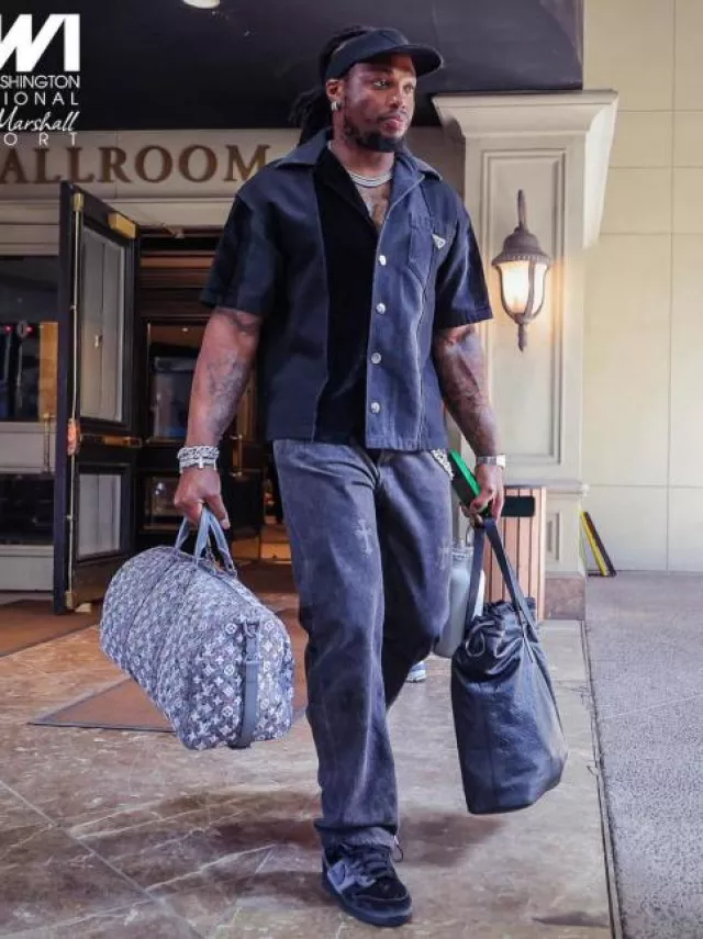 Prada Black Triangle Embroidered Visor worn by Derrick Henry on the Instagram account @ravens