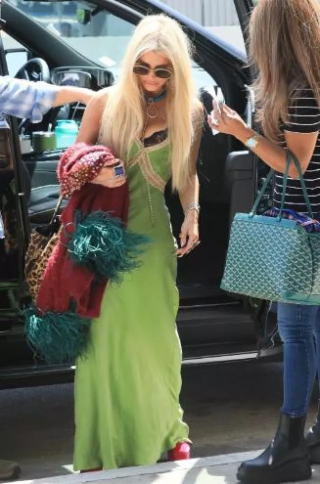 Saint Laurent Bea Ysl Leopard-Print Tote Bag in Calf Hair and Leather worn by Jessica Simpson in Los Angeles on September 3, 2024