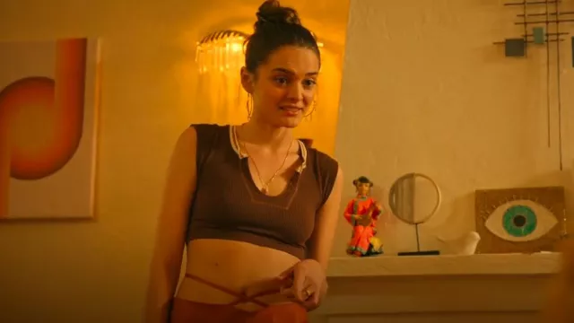 Out From Under Go For Gold Top worn by Caitlin (Charlotte Lawrence) as seen in Bad Monkey (S01E02)