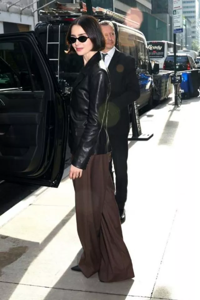 Magda Butrym Fitted Leather Blazer in Black worn by Lily Collins at Emily in Paris Season 4 Press on September 19, 2024
