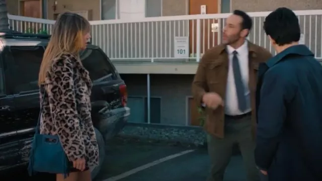 Maje Navy Mini M Tassel-Trimmed Suede Shoulder Bag worn by Morgan (Kaitlin Olson) as seen in High Potential (S01E01)