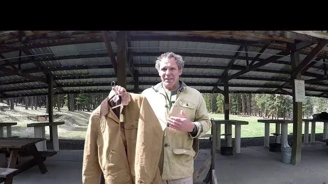 Paul Harell holds a Canvas Jacket in Paul's Shooting Jacket YouTube Video
