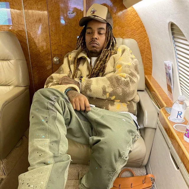 Cactus Jack Beige Abstract Sherpa Fleece worn by Wheezy on the Instagram account @wheezy