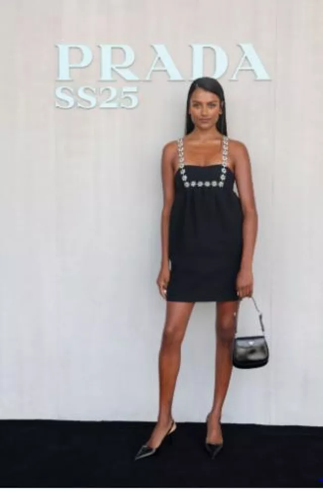 Prada 55M Patent Leather Slingback Pumps worn by Simone Ashley at Prada Show on September 19, 2024