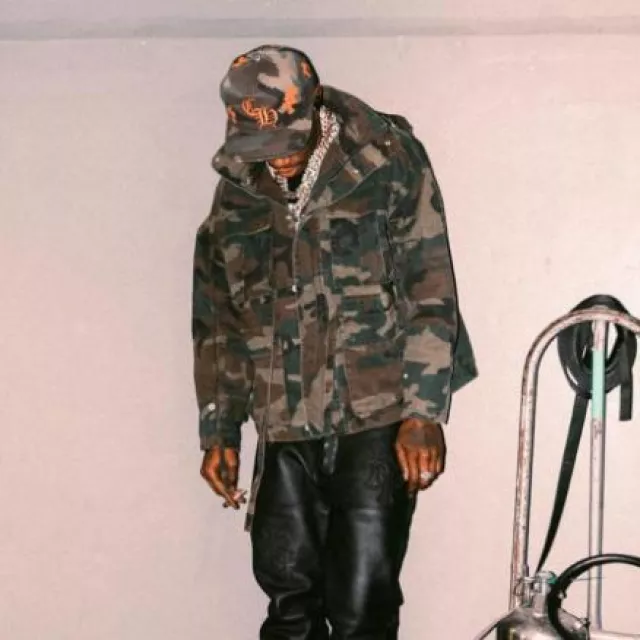 Chrome Hearts Green Camo & Orange Cross Patches CH Hat worn by A Boogie wit da Hoodie on the Instagram account @aboogievsartist