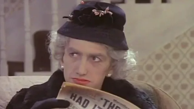 John Deacon is reading a Daily Mirror Newspaper in I Want To Break Free music video by Queen