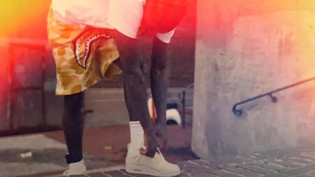 Jordan 4 Retro Metallic Gold worn by Quando Rondo in Quando Rondo - Luh Wodie [Official Music Video]
