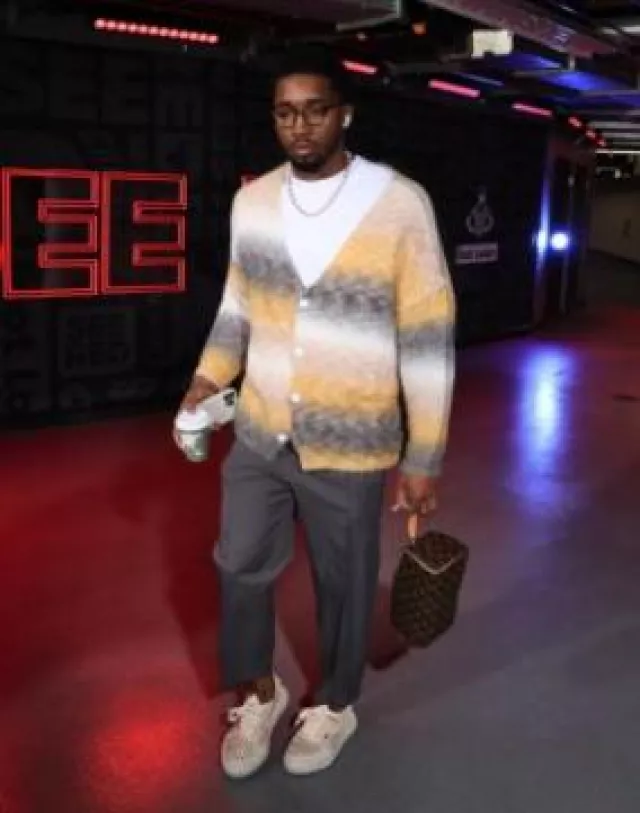 Louis Vuitton Brown Monogram Toiletry Pouch worn by Donovan Mitchell on the Instagram account @nbafashionfits