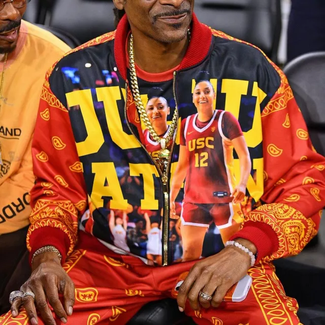 Snoop Dogg is wearing Juju Watkins Jacket at the USC-Notre Dame game on November 23, 2024