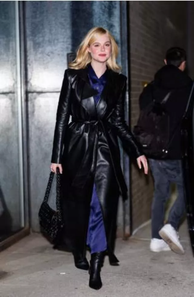 Khaite Chenton Silk Satin Midi Skirt in Navy worn by Elle Fanning at a Complete Unknown New York Screening on November 23, 2024