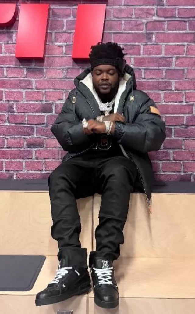 Louis Vuitton Black Monogram Leather LV Trainer Sneakers worn by BossMan Dlow on the Instagram account @bossman_dlow