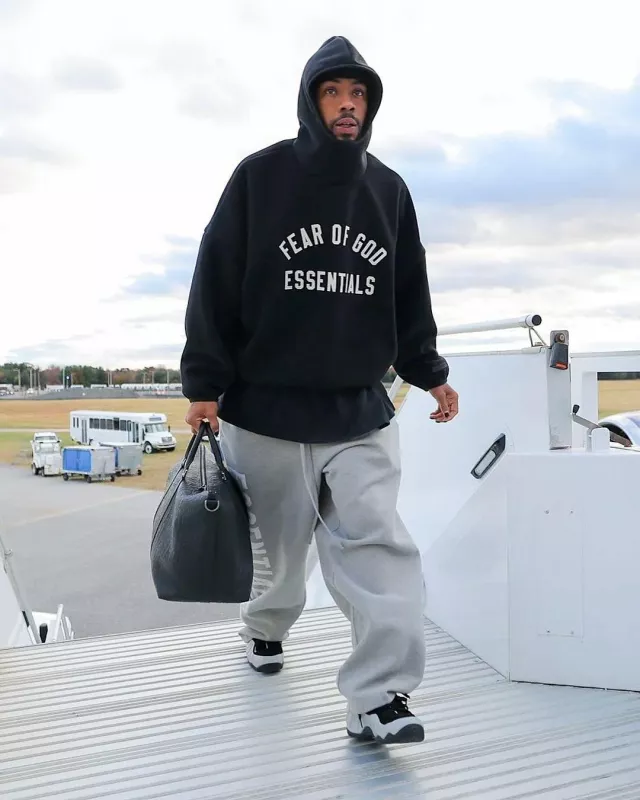 Fear Of God Grey Heather Vertical Logo Sweatpants worn by Rashod Bateman on the Instagram account @blitzfits
