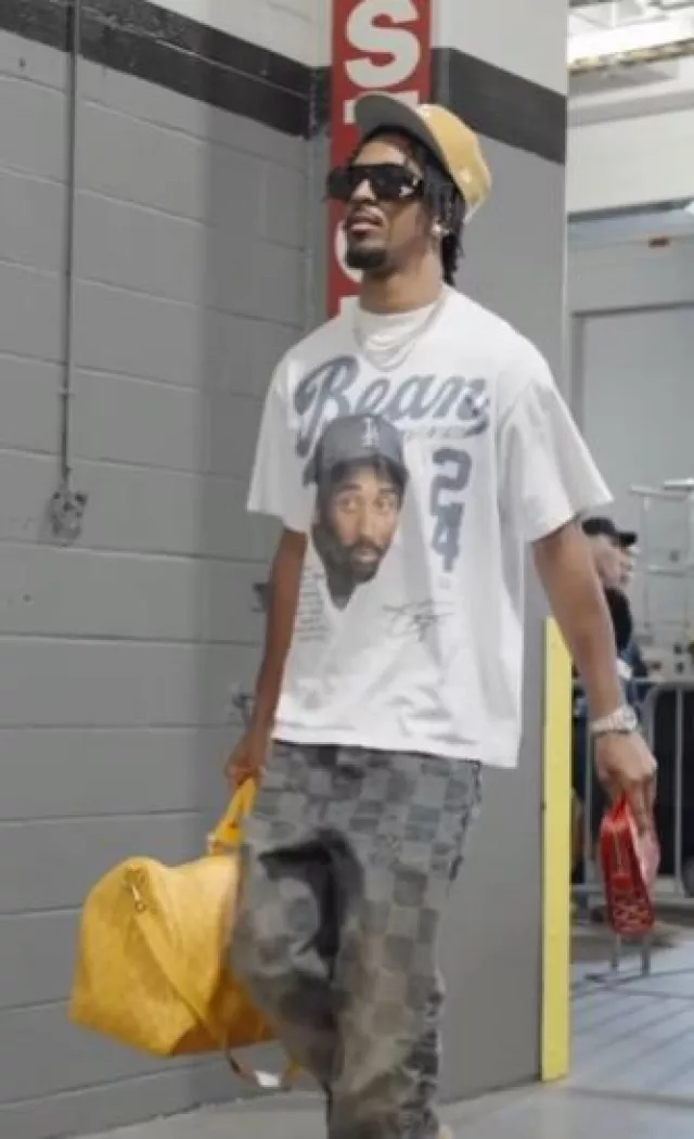 Louis Vuitton Yellow Heritage Monogram Keepall 45 Bag worn by Jayden Daniels on the Instagram account @blitzfits