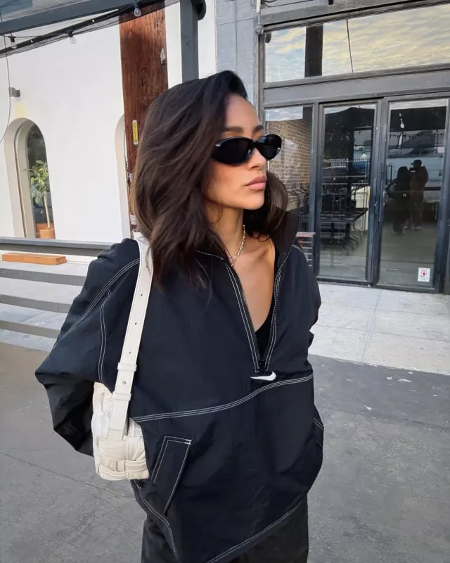 Bottega Veneta Brick Cassette Shoulder Bag worn by Shay Mitchell on her Instagram Post on December 11, 2024