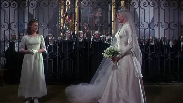 Outfits of The Sound of Music:  Maria (Julie Andrews) wears Ivory Slubbed Long Sleeve Silk Wedding Gown in the movie
