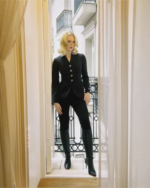 Versace 90S Vintage Logo Stirrup Leggings worn by Elle Fanning at A Complete Unknown London Press on December 17, 2024