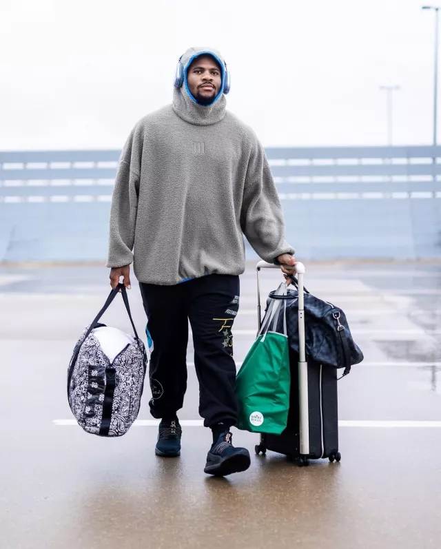 Louis Vuitton Black Giant Monogram Leather Horizon 55 Suitcase worn by Micah Parsons on the Instagram account @dallascowboys