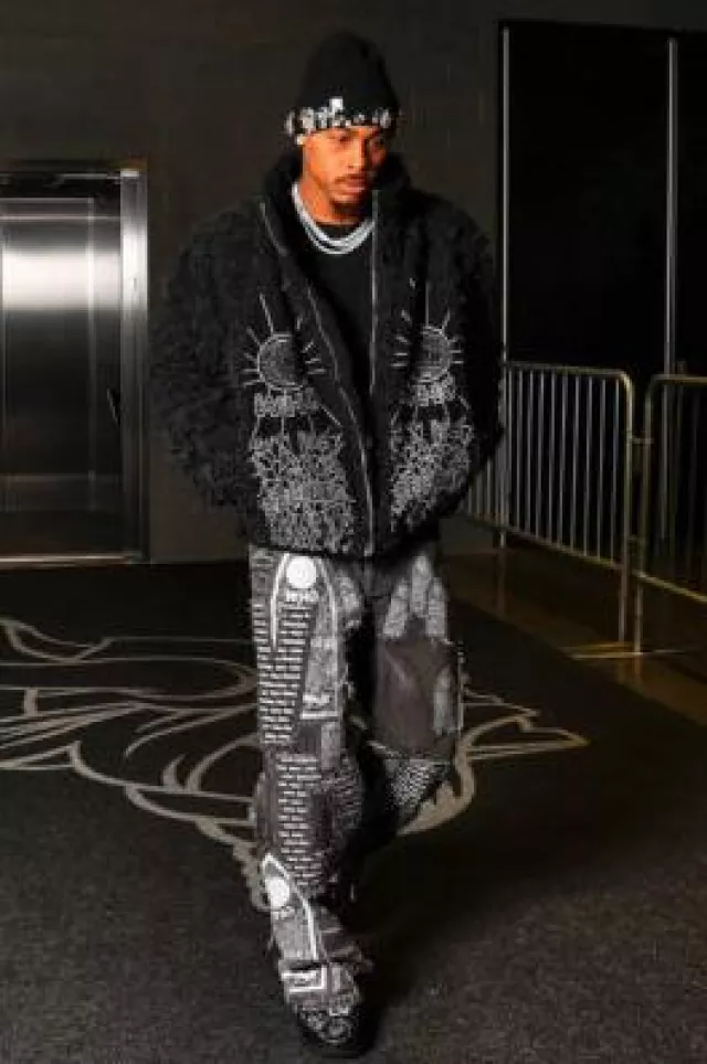 Who Decides War Faded Black Motif Patches Baggy Jeans worn by Justin Jefferson on the Instagram account @1jjuggernaut