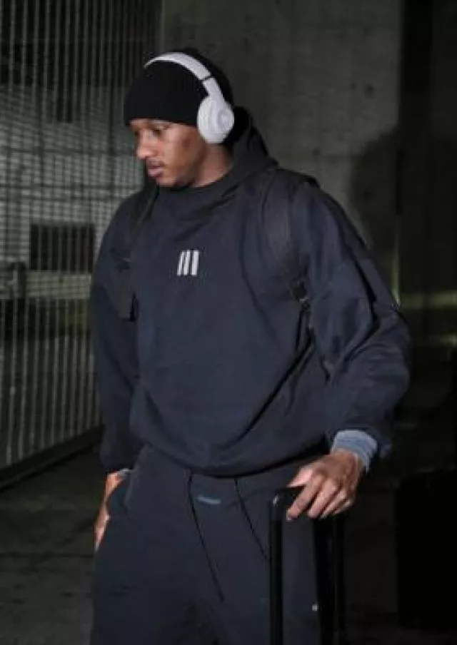 Adidas Fear Of God Athletics x Adidas Black Fleece Hoodie worn by Michael Penix Jr. on the Instagram account @commanders