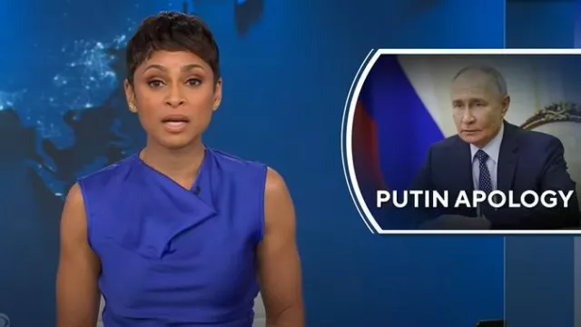 Herve Leger Audrey Satin Cowl Top in Violet worn by Jericka Duncan as seen in CBS Evening News on  December 30, 2024