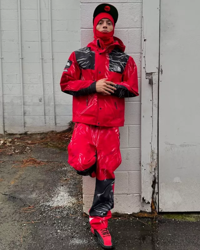 Supreme The North Face Red Shiny Hooded Shell Jacket worn by Central Cee on the Instagram account @centralcee