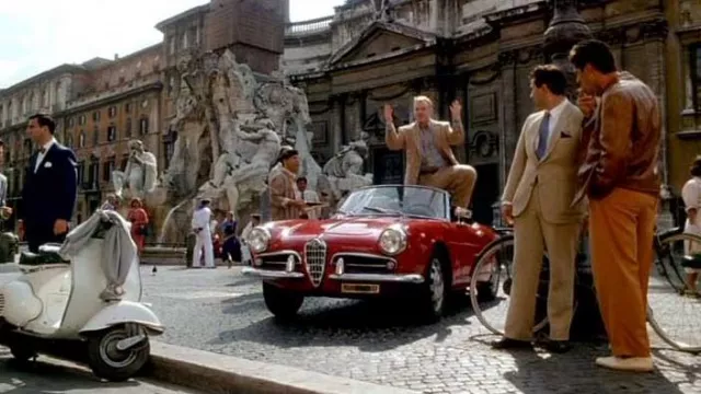 Red 1955 Alfa Romeo Giulietta Spider car driven by Freddie Miles (Philip Sey­mour Hoff­man) as seen in The Talented Mr. Ripley movie