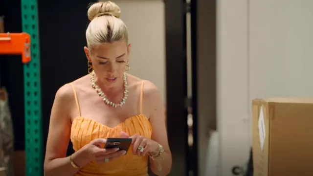 ASTR Vietta Papaya Orange Pleated Corset Stretch Cotton Mini Dress worn by Heather Rae Young as seen in The Flipping El Moussas (S02E05)
