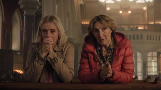 Outfits of Bad Sisters: Fiona Shaw wears red down jacket to portray Angelica Collins in season 2, episode 2