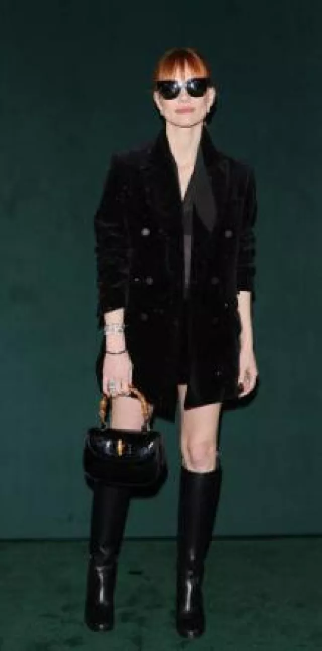 Gucci Bamboo 1947 Medium Top Handle Bag in Patent Leather worn by Jessica Chastain at Gucci Show on February 25, 2025