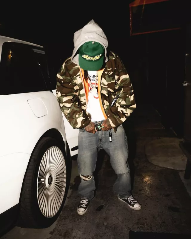 Balenciaga Light Wash Blue Ripped Knee Jeans worn by Wiz Khalifa on the Instagram account @wizkhalifa