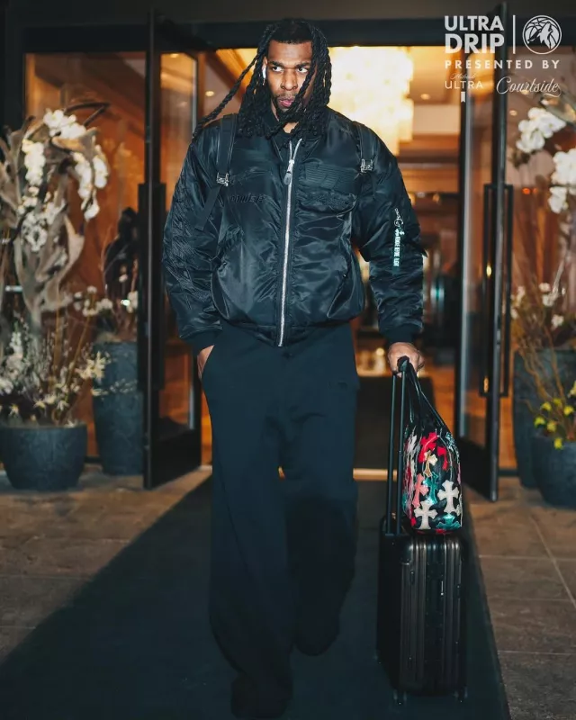 Vetements x Alpha Industries Black Racing Logos Bomber Jacket worn by Naz Reid on the Instagram account @timberwolves