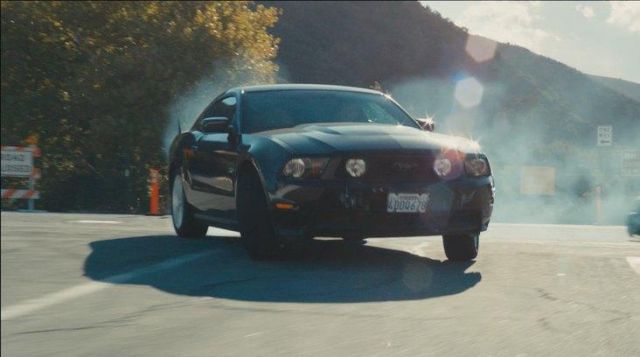 2011 Ford Mustang car in black driven by The Driver (Ryan Gosling) in Drive