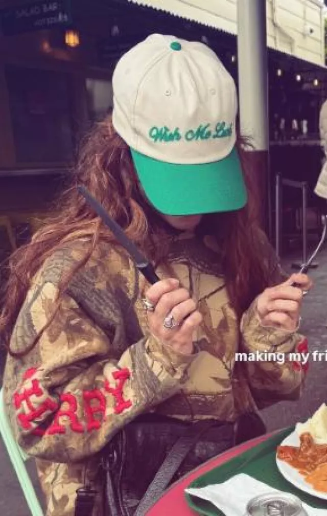 Wish Me Luck Signature Cap worn by Dixie D'Amelio at Gabriela Moura's Instagram Story on April 23, 2025